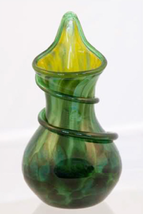 Green glass vase created by Langham Glass